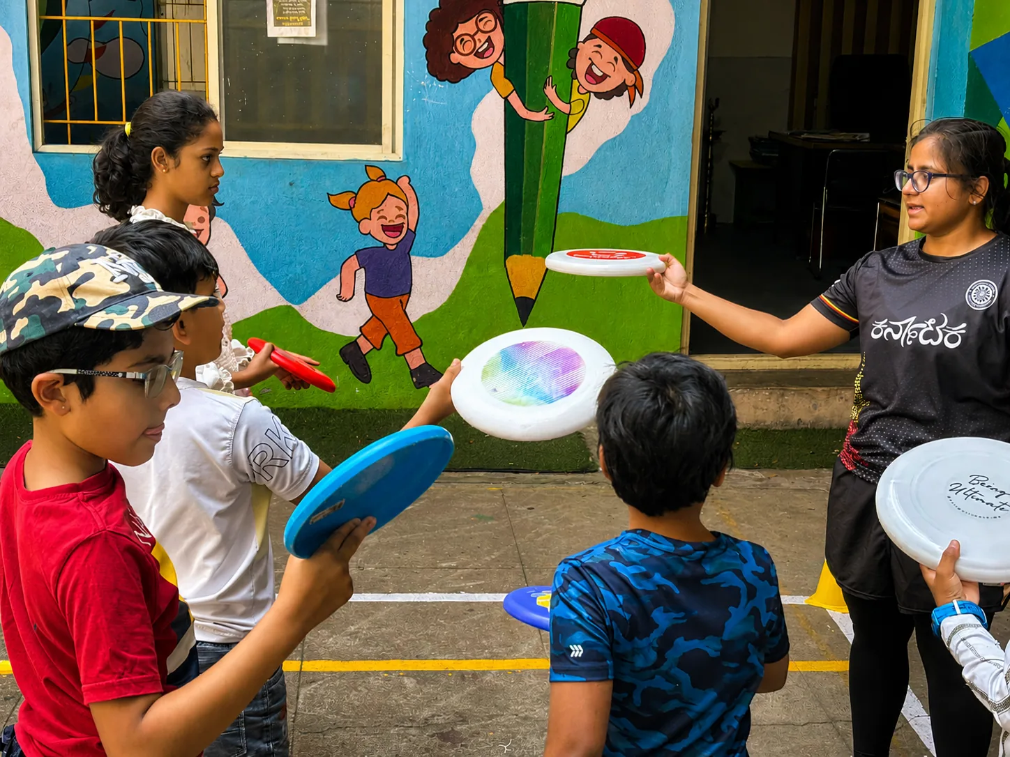 School children passing discs in a self-refereed game